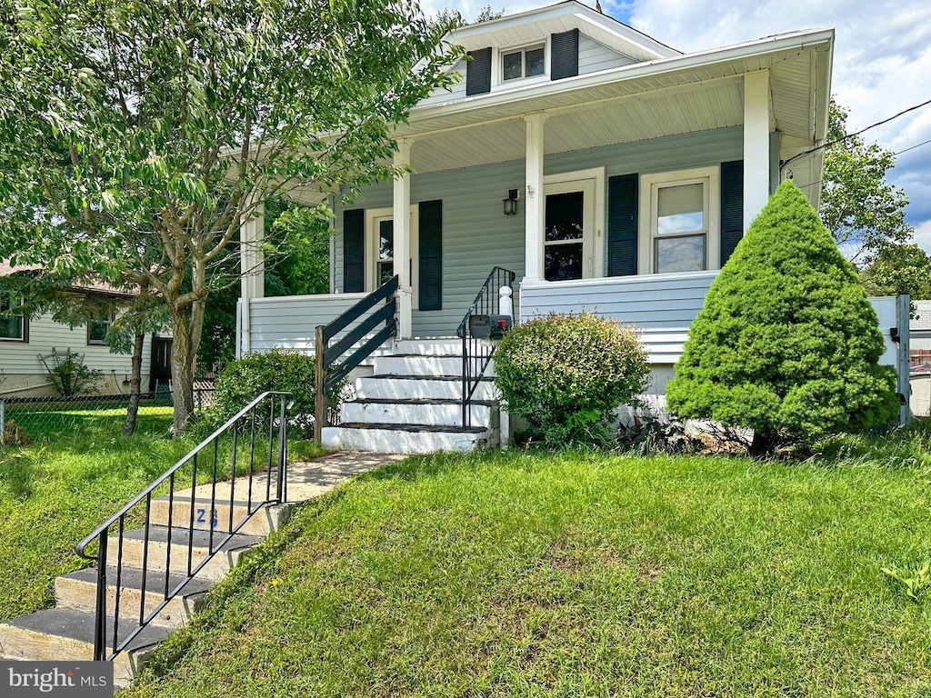 128 Grant Ave, West Collingswood Heights, NJ 08059 - bungalow-style home featuring covered porch, a front yard, and stairs