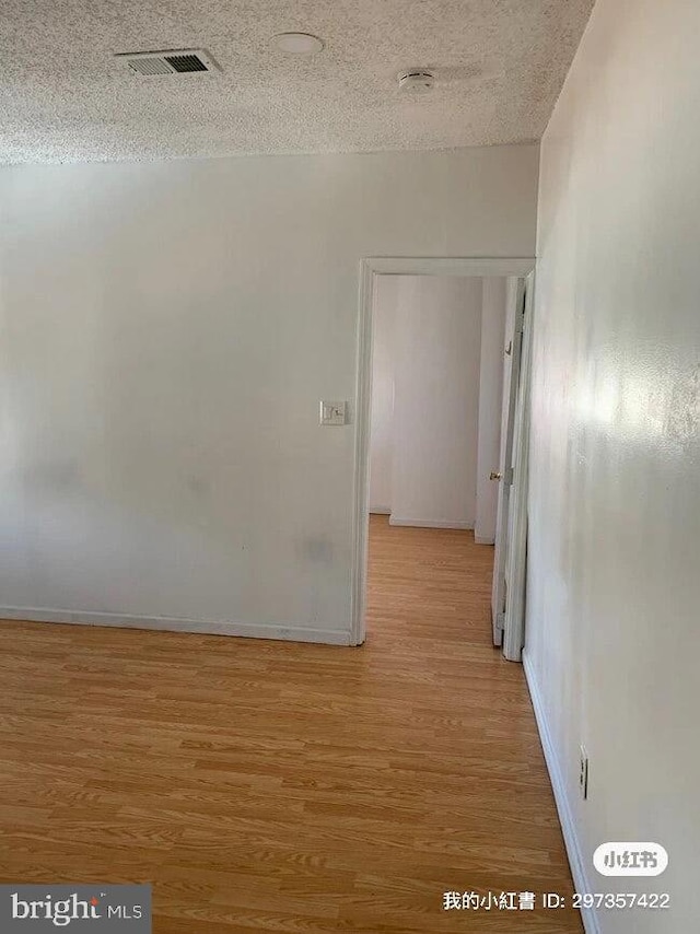2600 S Mildred St, Philadelphia, PA 19148 - corridor with light wood-style floors, baseboards, and a textured ceiling
