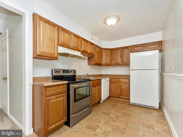7324 E Springbrook Ct, Middletown, MD 21769 - kitchen with white appliances, under cabinet range hood, light countertops, a sink, and brown cabinetry