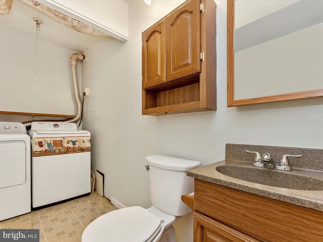 7324 E Springbrook Ct, Middletown, MD 21769 - half bath with washer and clothes dryer, vanity, and toilet