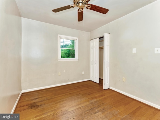 7324 E Springbrook Ct, Middletown, MD 21769 - unfurnished bedroom featuring wood finished floors, baseboards, a closet, and a ceiling fan