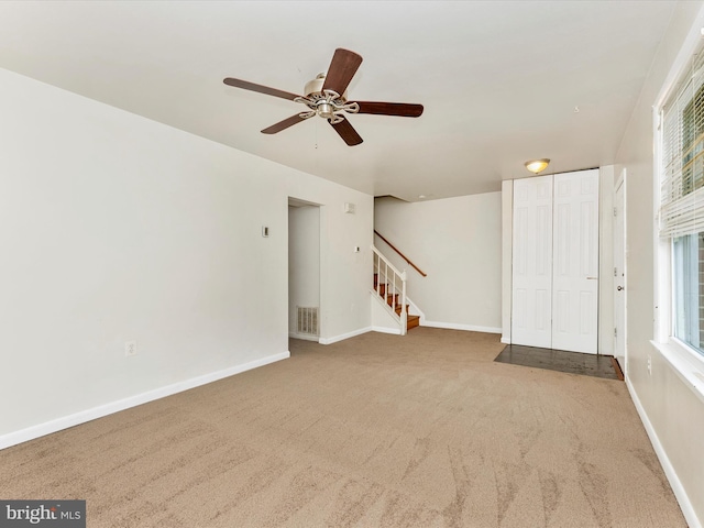 7324 E Springbrook Ct, Middletown, MD 21769 - unfurnished living room featuring carpet, stairway, ceiling fan, and baseboards