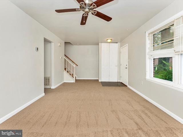 7324 E Springbrook Ct, Middletown, MD 21769 - empty room with carpet floors, a ceiling fan, baseboards, and stairs