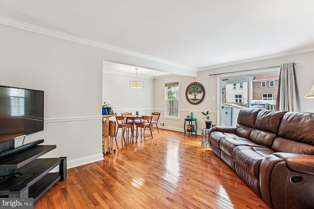 11910 Saint Johnsbury Ct, Reston, VA 20191 - living room with light wood finished floors, crown molding, and baseboards