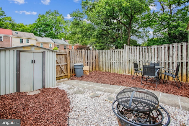 11910 Saint Johnsbury Ct, Reston, VA 20191 - fenced backyard featuring a gate and a fire pit