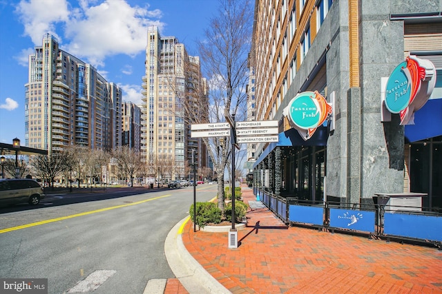 11910 Saint Johnsbury Ct, Reston, VA 20191 - view of asphalt street featuring street lighting, sidewalks, curbs, and a city view