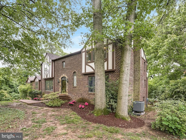 1316 Swan Harbour Rd, Fort Washington, MD 20744 - tudor house featuring central air condition unit and brick siding