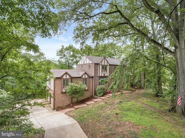 1316 Swan Harbour Rd, Fort Washington, MD 20744 - tudor home with concrete driveway and brick siding
