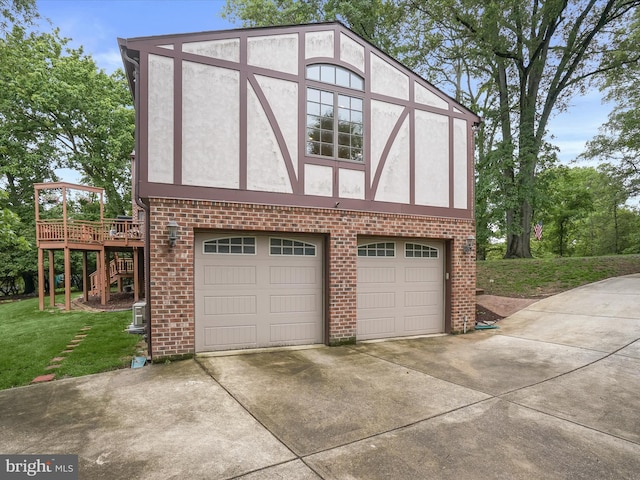 1316 Swan Harbour Rd, Fort Washington, MD 20744 - view of side of home featuring stucco siding, driveway, brick siding, and a yard