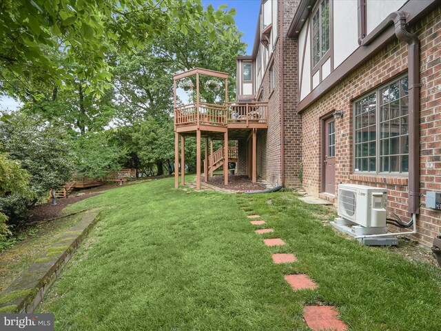 1316 Swan Harbour Rd, Fort Washington, MD 20744 - view of green lawn with a cooling unit, stairs, and a wooden deck