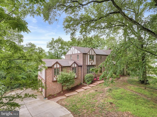 1316 Swan Harbour Rd, Fort Washington, MD 20744 - english style home featuring brick siding and concrete driveway