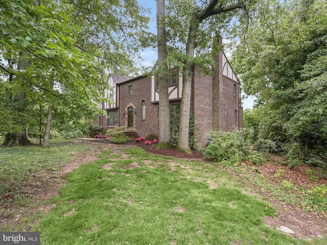 1316 Swan Harbour Rd, Fort Washington, MD 20744 - view of front facade featuring brick siding and a front lawn