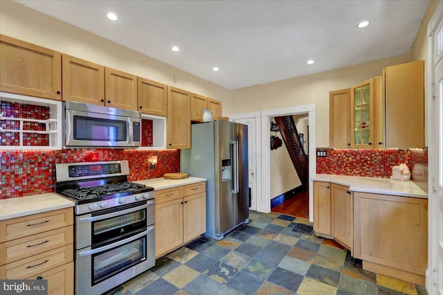 315 Nevin St, Lancaster, PA 17603 - kitchen with appliances with stainless steel finishes, light countertops, decorative backsplash, glass insert cabinets, and recessed lighting