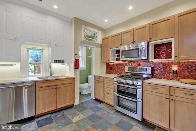 315 Nevin St, Lancaster, PA 17603 - kitchen featuring appliances with stainless steel finishes, a sink, light brown cabinets, light countertops, and recessed lighting