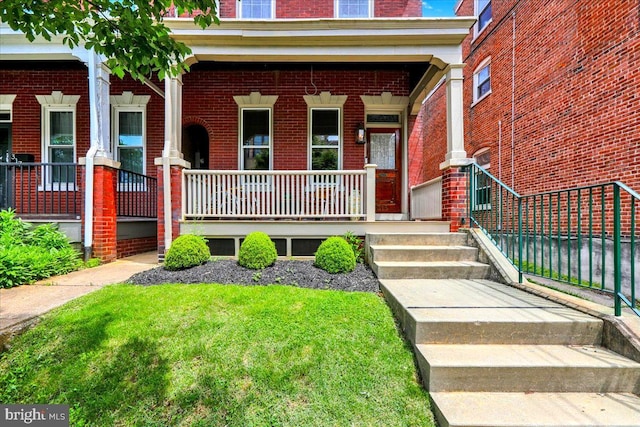 315 Nevin St, Lancaster, PA 17603 - property entrance with a porch and brick siding