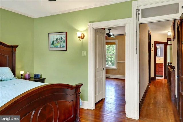 315 Nevin St, Lancaster, PA 17603 - bedroom with dark wood-style flooring, baseboards, and crown molding