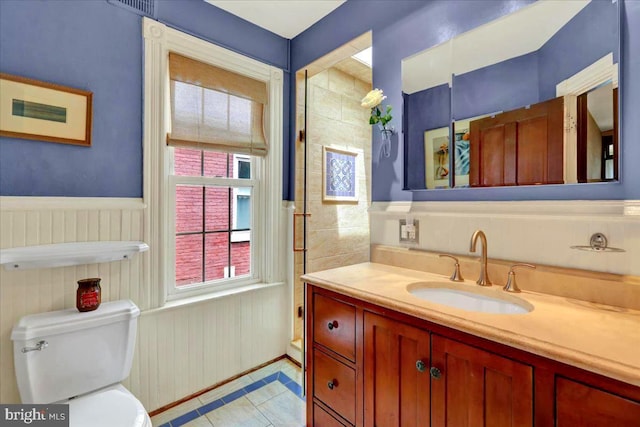 315 Nevin St, Lancaster, PA 17603 - bathroom featuring toilet, vanity, wainscoting, and tile patterned floors
