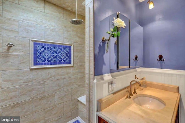 315 Nevin St, Lancaster, PA 17603 - bathroom featuring tiled shower, a wainscoted wall, and vanity