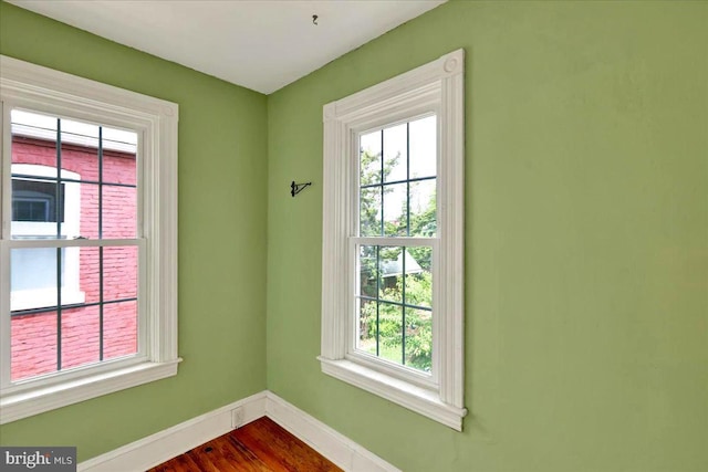 315 Nevin St, Lancaster, PA 17603 - unfurnished room featuring plenty of natural light, baseboards, and dark wood-style flooring