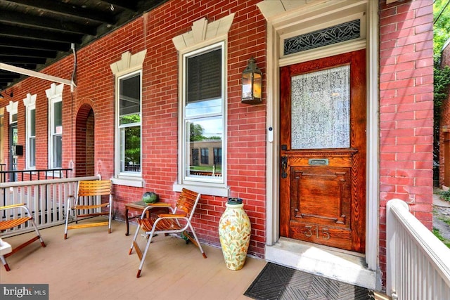 315 Nevin St, Lancaster, PA 17603 - property entrance featuring covered porch and brick siding