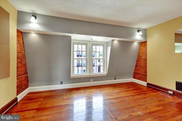 315 Nevin St, Lancaster, PA 17603 - spare room with hardwood / wood-style floors, baseboards, and a textured ceiling