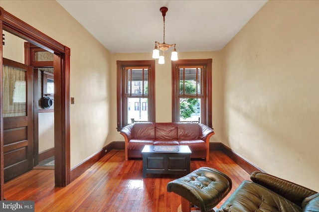 315 Nevin St, Lancaster, PA 17603 - living room featuring a chandelier, wood-type flooring, and baseboards