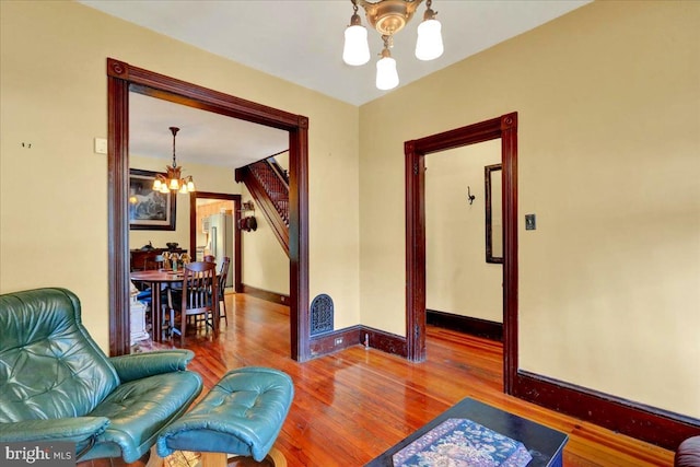 315 Nevin St, Lancaster, PA 17603 - sitting room with a chandelier, wood finished floors, and baseboards