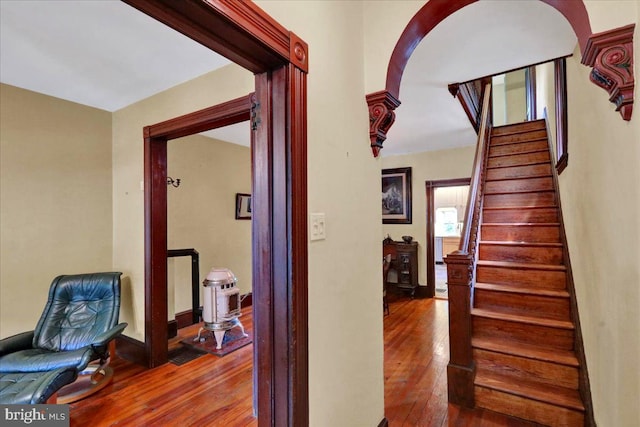 315 Nevin St, Lancaster, PA 17603 - hall featuring hardwood / wood-style floors, stairway, baseboards, and arched walkways