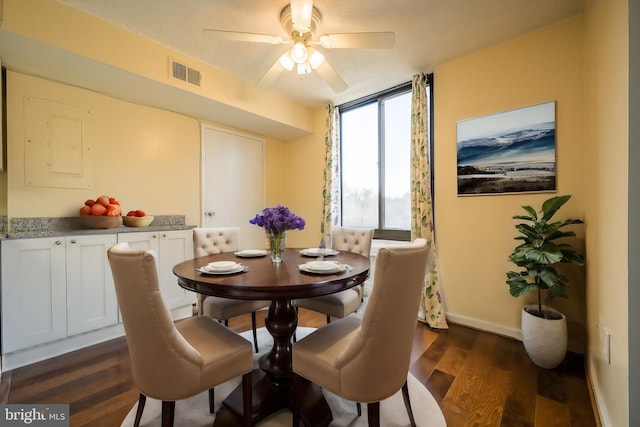 4500 Four Mile Run Dr Unit 211, Arlington, VA 22204 - dining space with dark wood-type flooring, a ceiling fan, baseboards, and expansive windows