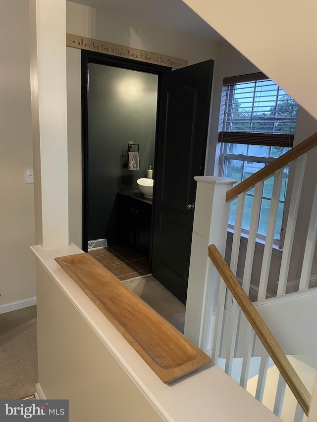 115 E Sheldrake Cir, Dover, DE 19904 - corridor with baseboards, carpet flooring, and stairway