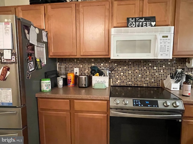 115 E Sheldrake Cir, Dover, DE 19904 - kitchen featuring appliances with stainless steel finishes and backsplash