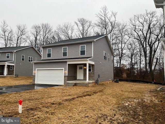 8917 Lennings Ln, Rosedale, MD 21237 - traditional-style home featuring a garage, asphalt driveway, and covered porch