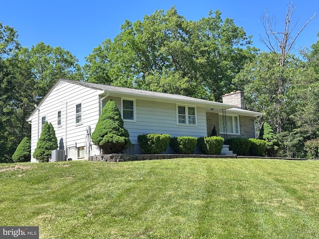 23 N Valley View Ln, Keyser, WV 26726 - view of front of home featuring a chimney, a front yard, and central AC unit