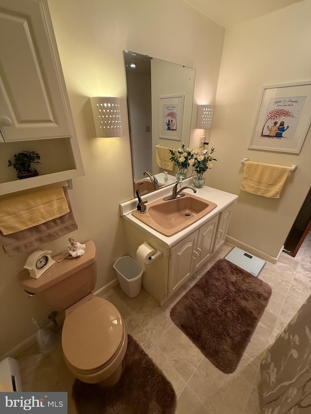 23 N Valley View Ln, Keyser, WV 26726 - bathroom with toilet, vanity, baseboards, and tile patterned flooring