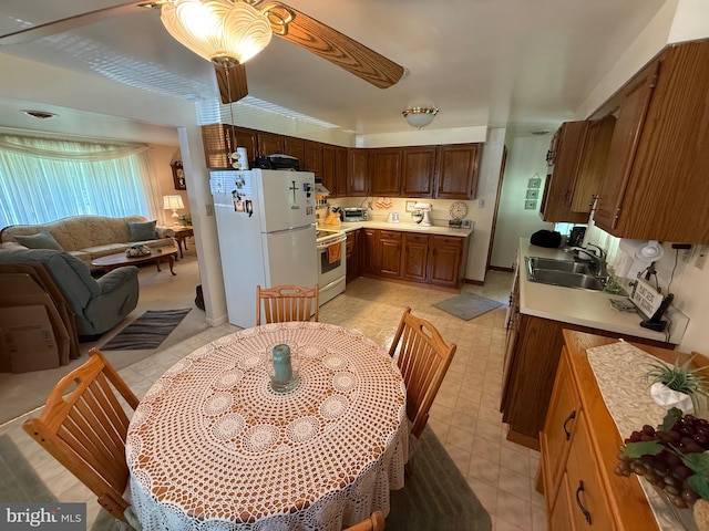 23 N Valley View Ln, Keyser, WV 26726 - kitchen with a sink, freestanding refrigerator, range with electric stovetop, light countertops, and open floor plan