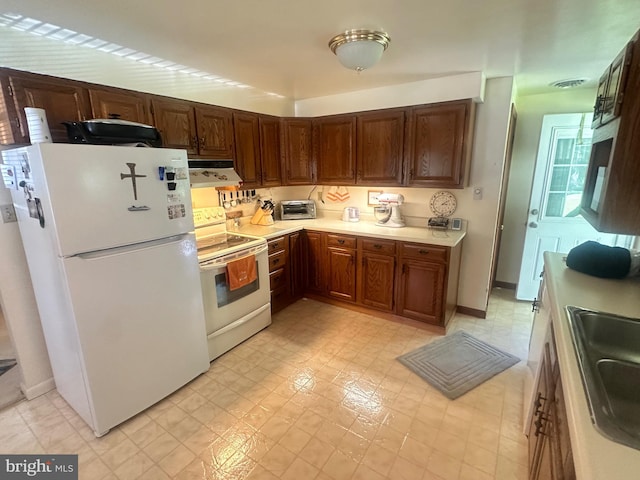 23 N Valley View Ln, Keyser, WV 26726 - kitchen featuring white appliances, under cabinet range hood, light countertops, a sink, and light flooring