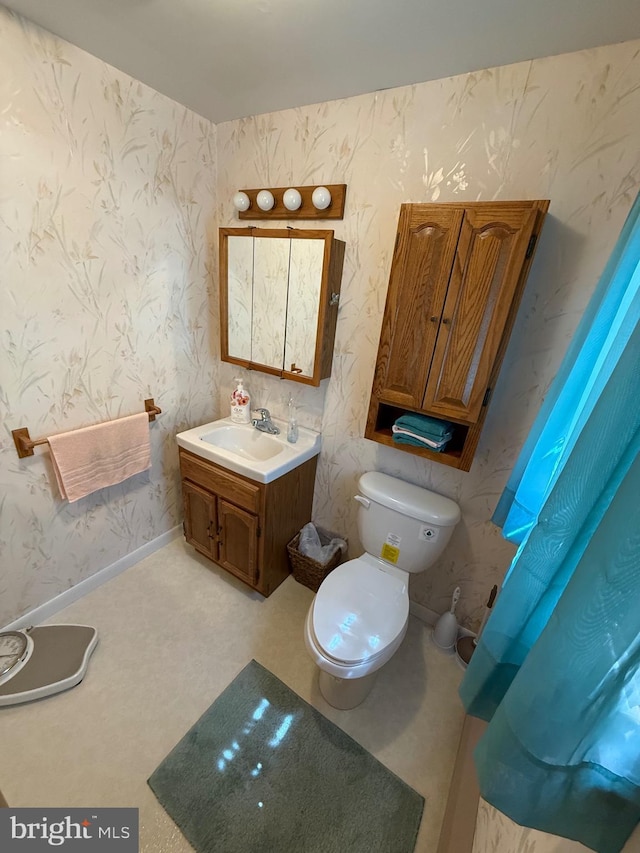 23 N Valley View Ln, Keyser, WV 26726 - bathroom with wallpapered walls, toilet, and vanity