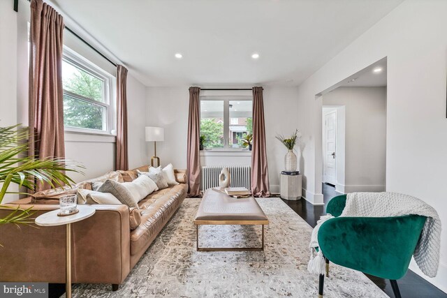 5319 Ames St NE, Washington, DC 20019 - living room with radiator, recessed lighting, wood finished floors, and baseboards