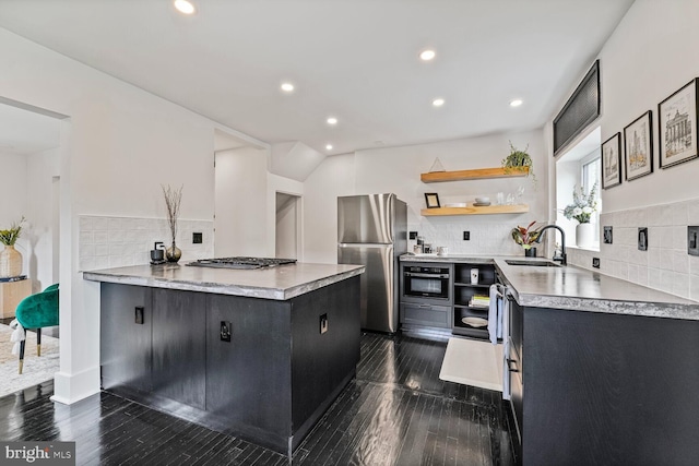 5319 Ames St NE, Washington, DC 20019 - kitchen featuring stainless steel appliances, open shelves, dark cabinets, decorative backsplash, and recessed lighting