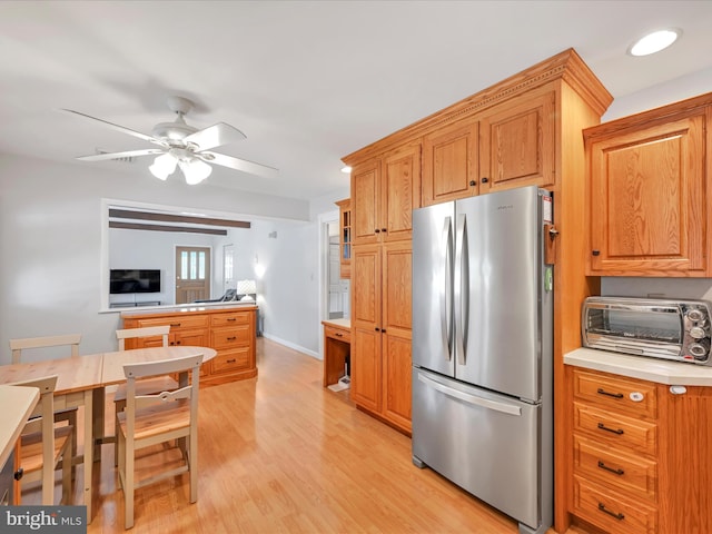 52 Circle Dr, Ephrata, PA 17522 - kitchen with freestanding refrigerator, light wood-style flooring, light countertops, ceiling fan, and baseboards