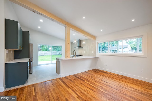 1674 Lafayette Way, Blue Bell, PA 19422 - kitchen featuring wall chimney range hood, plenty of natural light, light countertops, light wood finished floors, and recessed lighting