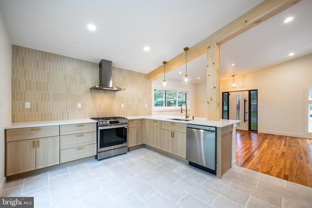 1674 Lafayette Way, Blue Bell, PA 19422 - kitchen featuring appliances with stainless steel finishes, wall chimney range hood, light countertops, light tile patterned floors, and recessed lighting