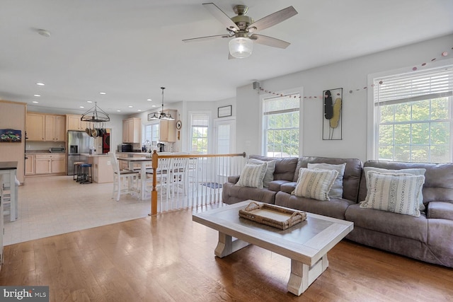 5040 Hummingbird Ln, Warrenton, VA 20187 - living room featuring ceiling fan, recessed lighting, light wood finished floors, and a chandelier