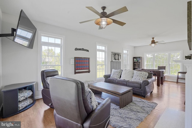 5040 Hummingbird Ln, Warrenton, VA 20187 - living room featuring plenty of natural light, a ceiling fan, wood finished floors, and baseboards