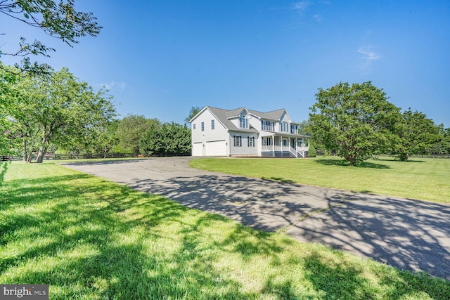 5040 Hummingbird Ln, Warrenton, VA 20187 - traditional home with asphalt driveway, an attached garage, and a porch