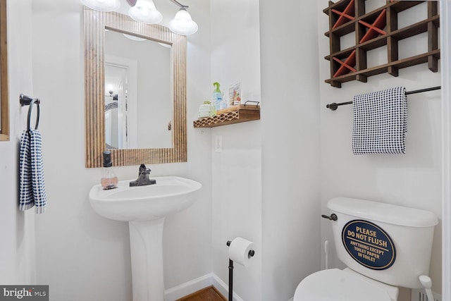 5040 Hummingbird Ln, Warrenton, VA 20187 - bathroom with toilet, baseboards, and a sink