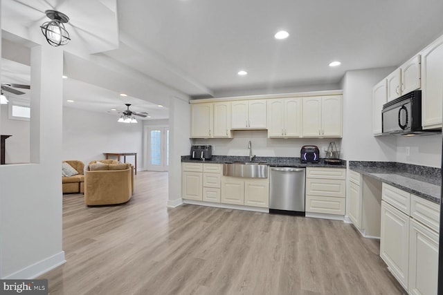 5040 Hummingbird Ln, Warrenton, VA 20187 - kitchen with stainless steel dishwasher, a sink, ceiling fan, black microwave, and light wood finished floors