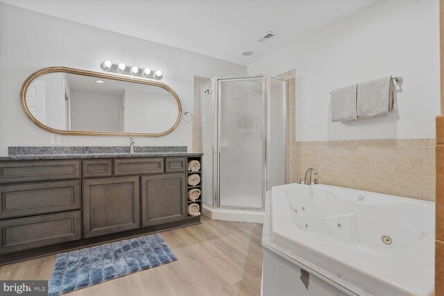 5040 Hummingbird Ln, Warrenton, VA 20187 - bathroom with a stall shower, vanity, a whirlpool tub, and wood finished floors