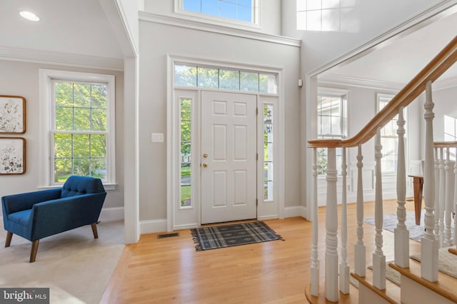 11 Woods Edge Rd, West Chester, PA 19382 - entryway with plenty of natural light, light wood-type flooring, baseboards, crown molding, and stairway