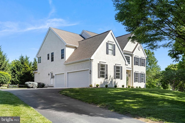 11 Woods Edge Rd, West Chester, PA 19382 - view of front of home featuring driveway, a garage, a front yard, and stucco siding